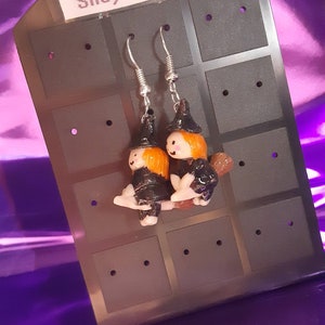 Witch on a broom Halloween earrings