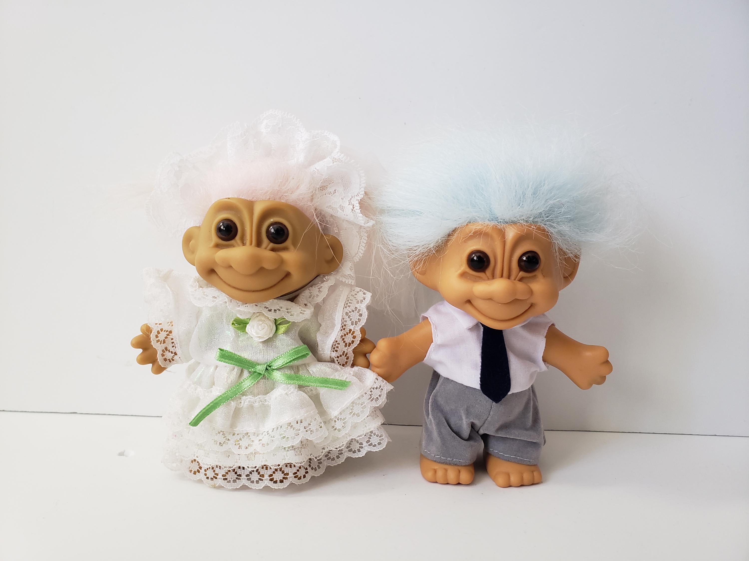 Bride and groom troll dolls top