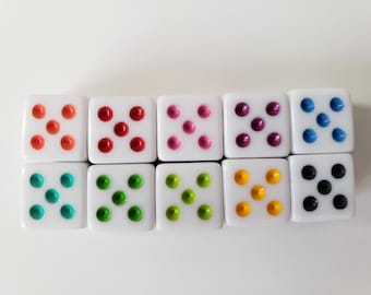 May include: Eight white dice with different colored dots. The colors are orange, red, pink, purple, blue, teal, green, and black.