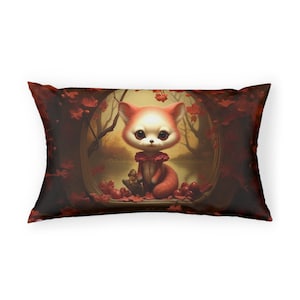 May include: Rectangular decorative pillow featuring a whimsical illustration of a red fox with large eyes, wearing a pink collar, and sitting in a forest scene. The pillow has a dark red border and is filled with red leaves and a small animal.
