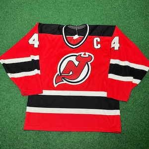 May include: A rustic wooden sign with the text "Welcome" in a handwritten style. The sign is painted white with a distressed finish, and features a decorative floral element. The background is a blurred image of a wooden surface.