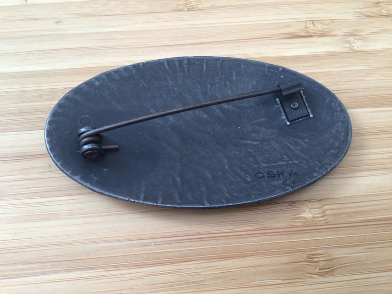 Vintage designer brooch by O S K A