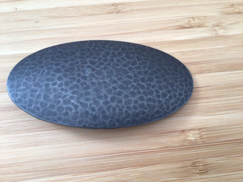 Vintage designer brooch by O S K A