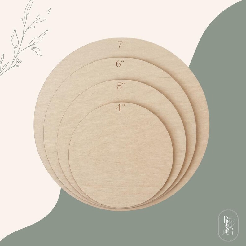 May include: A set of four circular light-colored wooden discs stacked on top of each other. Each disc is labeled with its diameter in inches, specifically 4 inches, 5 inches, 6 inches, and 7 inches, printed clearly on the surface of the wood.
