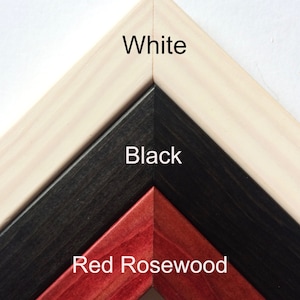 May include: Close-up of three picture frame corners in white, black, and red rosewood. The colours are labelled with the text "White", "Black", and "Red Rosewood". The frames are angled to show the different colours and textures.