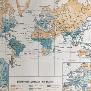 May include: Vintage world map illustration showing annual rainfall distribution. The map uses blue and tan hues to depict different precipitation levels across continents and oceans. Text in French labels regions.