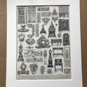 May include: Black and white print of various antique furniture and decorative elements. The print includes detailed illustrations of cabinets, clocks, and ornate carvings, all presented in a classic, vintage style. The print is matted in a white frame.