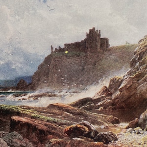 May include: A painting of a rocky coastline with a large, gray stone castle perched on a cliff in the distance. The sea is choppy and whitecaps are visible. The sky is cloudy and gray.