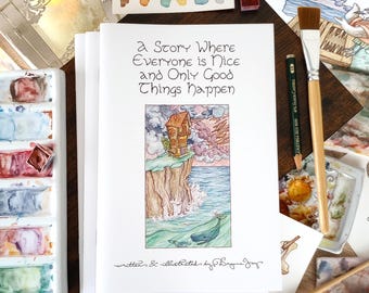 Könnte beinhalten: Eine Ansammlung von Aquarelldrucken und Zubehör auf einer Holzoberfläche. Der zentrale Druck zeigt ein Haus auf einer Klippe mit dem Text "a Story Where Everyone is Nice and Only Good Things Happen." Aquarellpaletten, Pinsel und Bleistifte sind ebenfalls zu sehen.