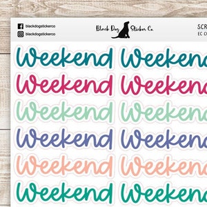 May include: A sheet of colorful stickers with the word "Weekend" written in a handwritten style. The stickers are in various colors, including blue, green, pink, orange, yellow, and purple.