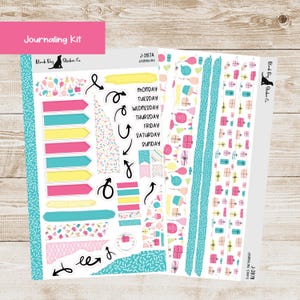 May include: A journaling kit with stickers featuring arrows, labels, and decorative strips. The stickers include the days of the week, and the text "Journaling Kit". The color palette includes pink, yellow, teal, and white.