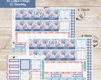 May include: A collection of planner stickers with a summer theme. The stickers feature flamingo and floral designs, with the month of July prominently displayed. The stickers are designed for A5 coiled and ring planners.
