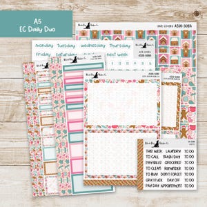 May include: A collection of planner stickers with a gingerbread theme. The stickers feature pink, teal, and brown colors with various designs, including gingerbread houses, candies, and decorative elements. The set includes labels for the days of the week and other planning tasks.