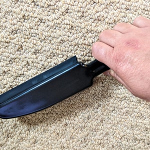 Berkeley's Pet Hair Remover Brush effectively brushes away pet hair from carpets.