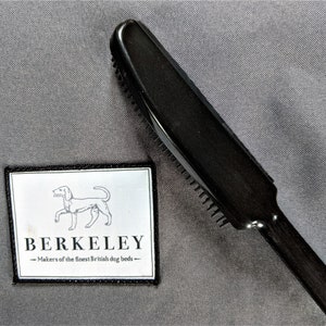 A Berkeley Dog Hair Remover Brush helps keep pet bedding free from pet hair, debris and soiling.