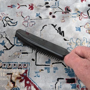 Berkeley's Dog Hair Remover Brush helps rid rugs and carpets of unwanted dog hair.