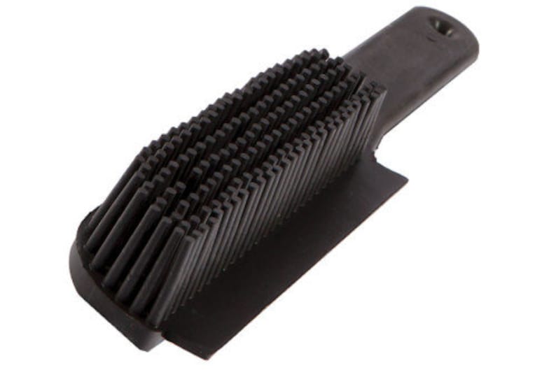The Rubber Splines of a Berkeley Dog Hair Remover Brush quickly brush away pet hair.