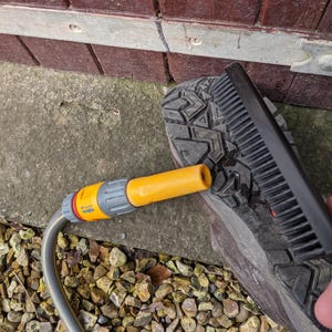 A Berkeley Dog Hair Remover Brush makes cleaning muddy boots a simple task.