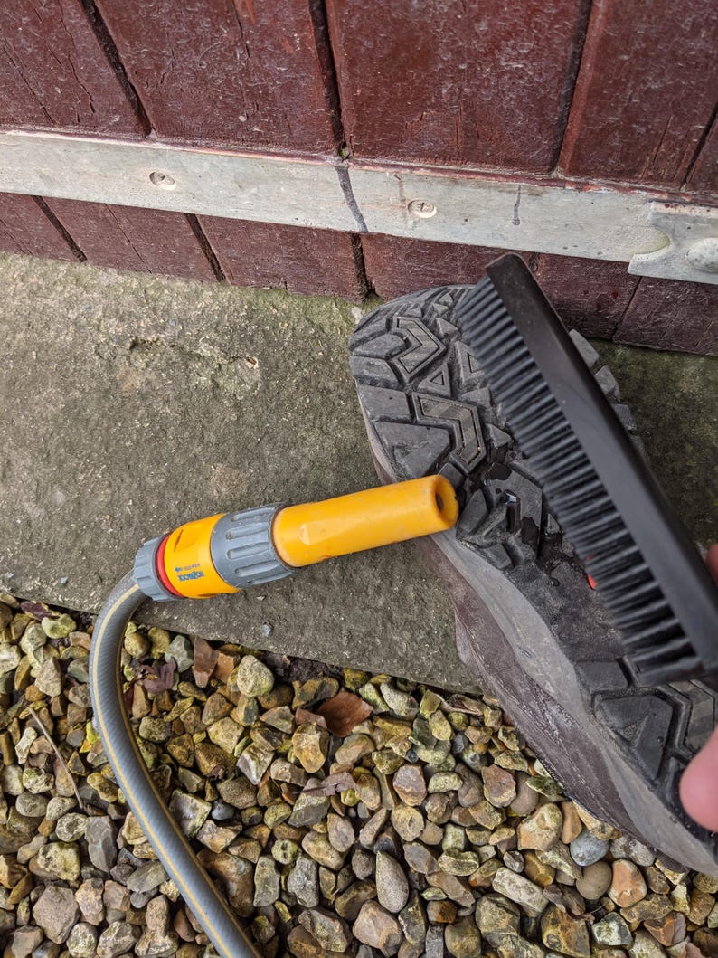 A Berkeley Dog Hair Remover Brush makes cleaning muddy boots a simple task.
