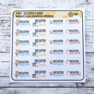 May include: A sheet of six rows of colorful stickers with the text "#1077 - Declutter It Series" and "Magazines/Books/Newspapers/Paperwork" at the top. Each row has four stickers with the text "Declutter" and an image of a magazine, book, newspaper, or paperwork.