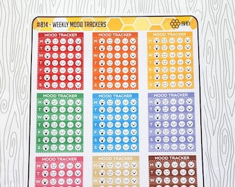 May include: A sheet of 12 weekly mood trackers with different colored backgrounds. Each tracker has a grid of 28 circles with different facial expressions to track mood.