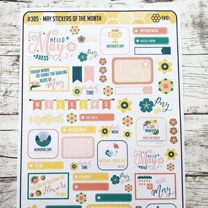 May include: A sheet of colorful stickers with a May theme. The stickers feature various designs, including flowers, stars, and text. Some of the stickers have text that says "Hello May", "Weekend", "Important", "Pay Day", "Family Time", "To Do", "Reminder", "Appointment", "Date Night", "National Space Day", "Memorial Day", "Cinco de Mayo", "National Wine Day", and "You Are As Welcome As Flowers In May".