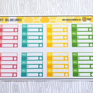 May include: A sheet of colorful bill due labels with a honeycomb pattern. The labels are designed for use in a planner or journal to track bills and due dates. Each label has space for the bill name, amount, and a due date.