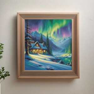 May include: A framed painting depicting a cosy cabin nestled in a snowy forest with a vibrant aurora borealis in the sky. The cabin has a warm glow from the windows and is surrounded by tall pine trees.
