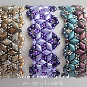 May include: Three beaded bracelets in different colour combinations. The bracelets are made with small, faceted beads in shades of gold, purple, and teal. The bracelets are arranged horizontally, with the gold bracelet on the left, the purple bracelet in the middle, and the teal bracelet on the right. The text "Wisteria Bracelet Tutorial By Poetry in Beads" is printed below the bracelets.