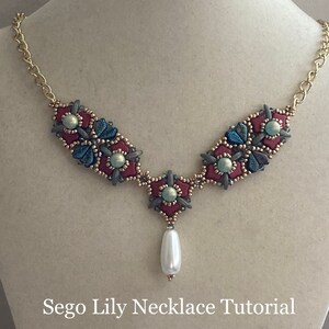 May include: A Sego Lily necklace tutorial by Poetry in Beads, featuring a beaded necklace with a burgundy, blue, and green color scheme and a single pearl drop.