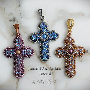 May include: Three beaded cross pendants in purple, blue, and gold. The crosses are adorned with sparkling beads and feature a central bead. The image includes text that reads "Jeanne d'Arc Pendant Tutorial by Poetry in Beads."