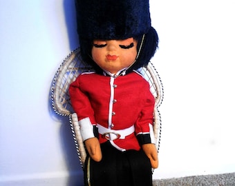 Adorable sleeping London Guard sitting doll without rattan chair 25" x 8" art doll or for year-round display