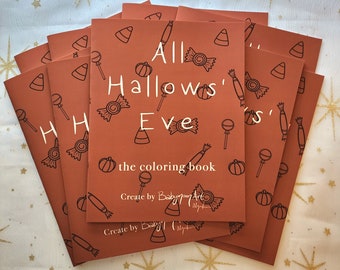 May include: A stack of orange coloring books with the text "All Hallows' Eve" and "the coloring book" in white. The cover features candy corn, pumpkins, and other Halloween-themed illustrations. The artist's name is also printed on the cover.