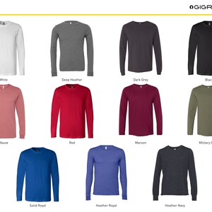K&ouml;nnte beinhalten: Eine Auswahl an Langarm-T-Shirts in verschiedenen Farben, darunter Wei&szlig;, Dunkelgrau meliert, Dunkelgrau, Schwarz, Mauve, Rot, Weinrot, Milit&auml;rgr&uuml;n, Royalblau uni, Royalblau meliert und Marineblau meliert.
