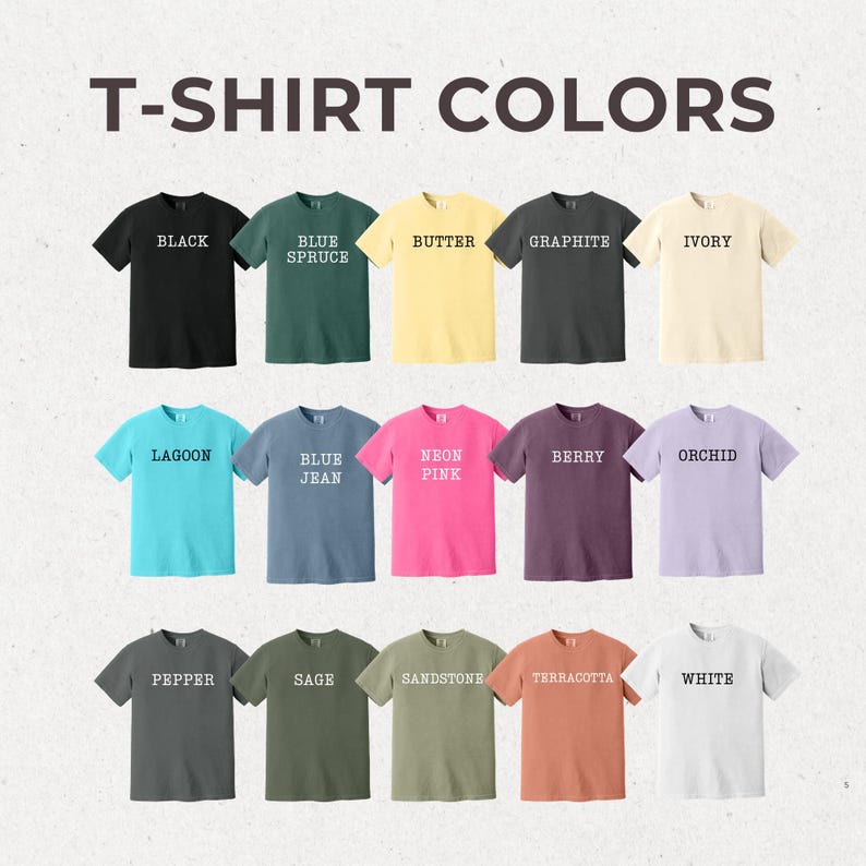 May include: A chart of 15 different t-shirt colors, each color is represented by a t-shirt with the color name printed on it in white text. The colors are: Black, Blue Spruce, Butter, Graphite, Ivory, Lagoon, Blue Jean, Neon Pink, Berry, Orchid, Pepper, Sage, Sandstone, Terracotta, and White.