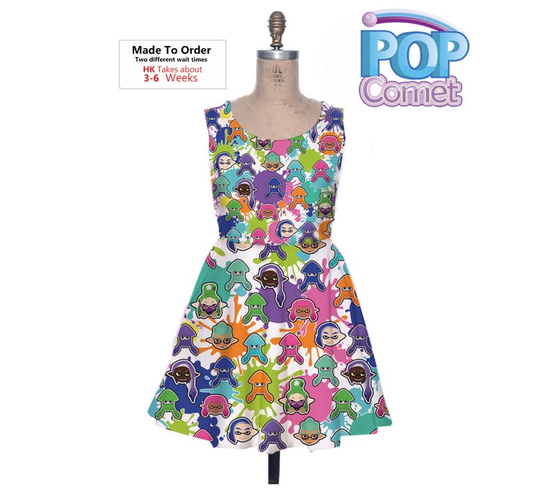 May include: White sleeveless dress with a colorful print of cartoon characters and paint splatters. The print features characters with different colored skin tones and hair. The dress has a flared skirt. The text "Made To Order" and "HK Takes about 3-6 Weeks" is printed on the dress.