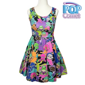 May include: A black sleeveless dress with a colorful print of cartoon squid characters and paint splatters. The dress has a fitted bodice and a flared skirt. The print features various colors, including pink, purple, green, blue, and orange.