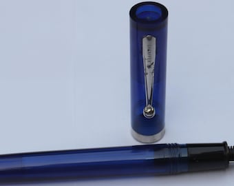 Vintage Sheaffer No Nonsense Fountain Pen Blue transparent Plastic body Medium Nib USA