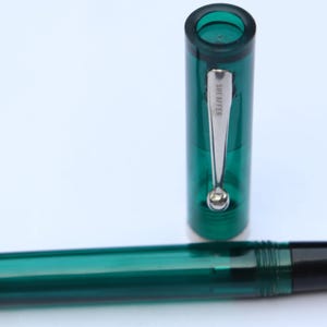 Vintage Sheaffer No Nonsense Fountain Pen Green Transparent Plastic body Medium steel nib USA