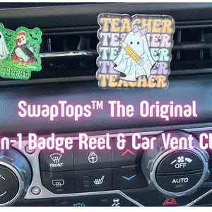 May include: A car vent clip and badge reel combo featuring two decorative designs. One design has a mummy, ghost, and chicken with the text "Chick or Treat." The other design says "Teacher" with a ghost holding a pencil.