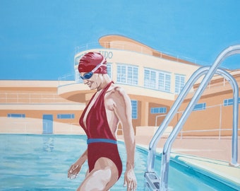 May include: A woman in a red swimsuit and goggles stands in a swimming pool. She is wearing a red swimming cap and is looking down at the water. The pool is surrounded by a concrete deck and a building with a sign that says "Studio".