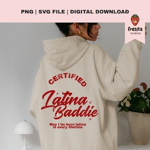 May include: A cream-coloured hoodie featuring the text "CERTIFIED Latina Baddie" in red script. The phrase "May I be born latina in every lifetime" is printed below. The hoodie is a digital download.