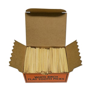May include: A box of white birch flat toothpicks. The box is open and the toothpicks are visible inside. The box is brown with orange text that reads "White Birch Flat Tooth Picks".
