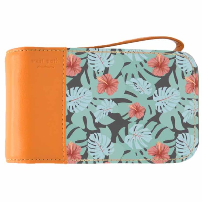 May include: A small orange and blue patterned wallet with a gold zipper and a small brown leather patch with the text "sweet pea" on the front.