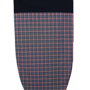 May include: A navy blue and plaid patterned fabric item. The top portion is solid navy blue, while the lower section features a blue, red, and black plaid design. The item has a rounded, shield-like shape.