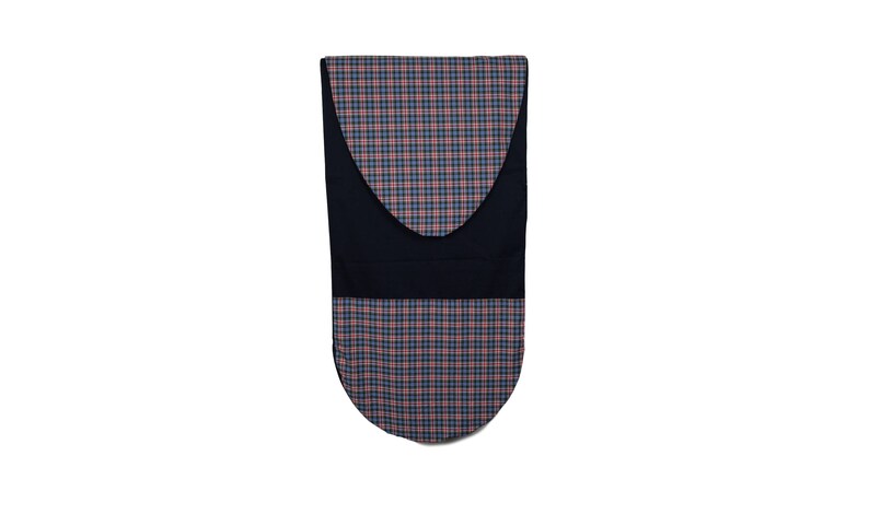 May include: A navy blue and plaid oven mitt. The plaid pattern features red, blue, and white squares. The mitt has a curved top and a rounded bottom. A solid navy blue band is in the middle of the mitt.