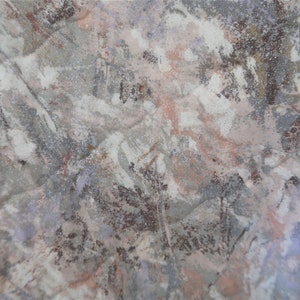 May include: Abstract fabric with a white, grey, and brown colour scheme. The fabric has a textured, mottled appearance.