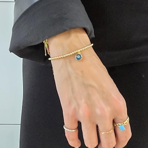 Pulsera de oro con protección contra el mal de ojo para mujer - Amuleto elástico apilable espiritual para el mal de ojo