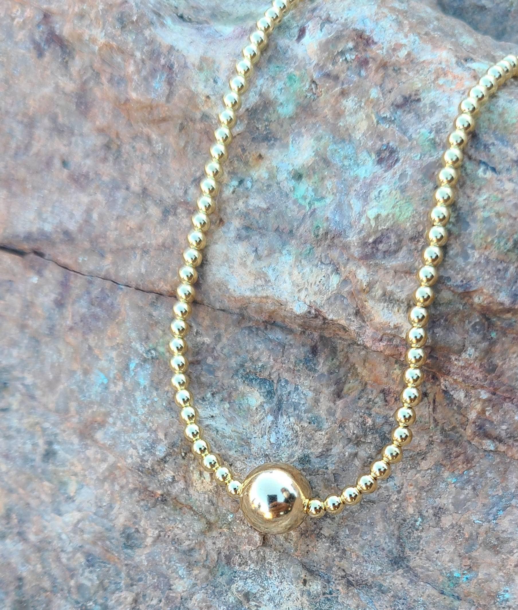 14kt Gold Filled Beaded Layering Necklace  Handcrafted with Gold-Filled Beads  10mm Bead Centerpiece  Adjustable Length  Isabella Celini