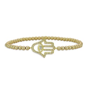Pulsera religiosa Hamsa chapada en oro con colgante de mano de circonita cúbica y diseño de cuentas
